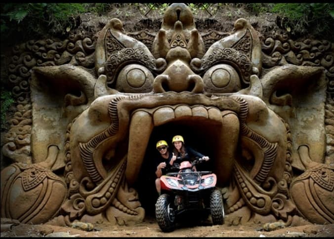 ATV quad bike riders on jungle track adventure in Bali