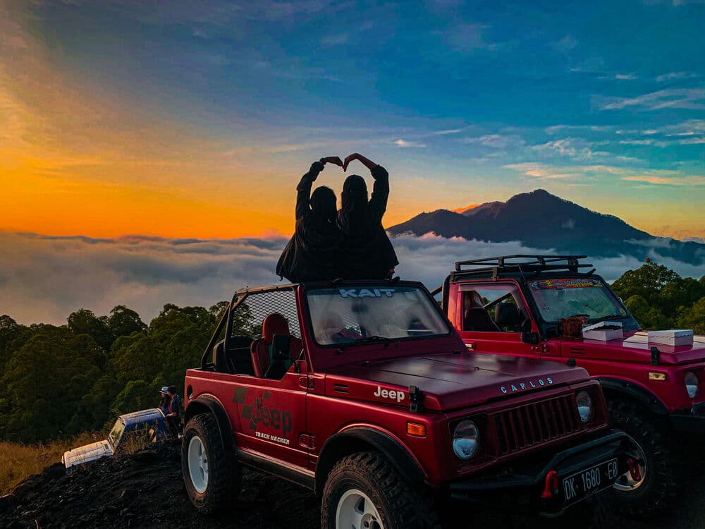 Private 4WD jeep on Mount Batur volcanic terrain at dawn