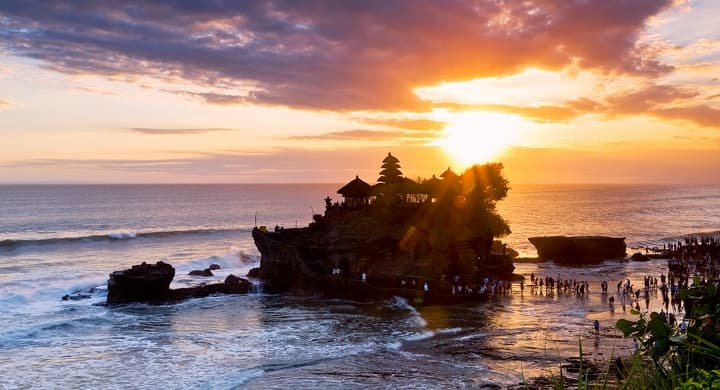 Tanah Lot sea temple silhouette at golden sunset Bali